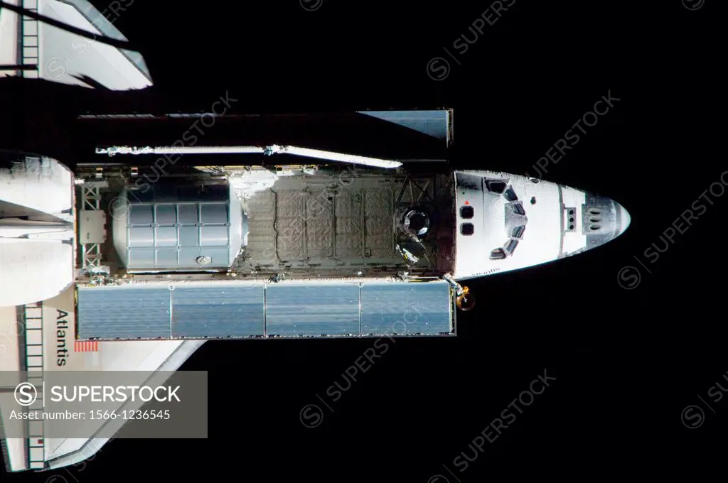 ISS028-E-015375 10 July 2011 --- A nadir view of the space shuttle Atlantis and its payload is provided by one of a series of images showing various p...