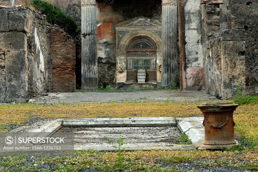 atrium of the House of the Large Fountain, the monumental fountain set in a nymphaeum against the back wall, archeological site of Pompeii, province o...