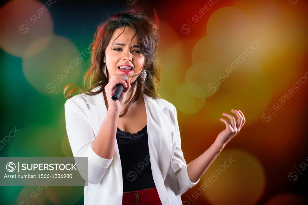 USA, Texas, Female Hispanic girl (16-17) singing