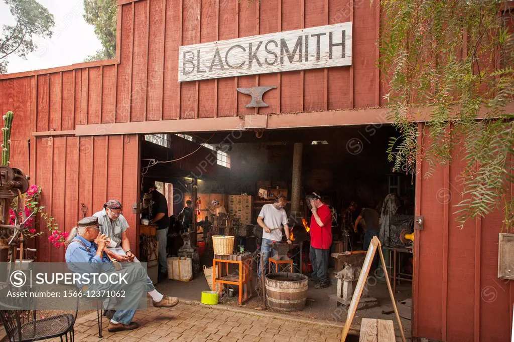 Using ancient techniques, modern day amateur blacksmiths work in an 1890´s-era shop in the Orange County Heritage Museum in Santa Ana, CA.