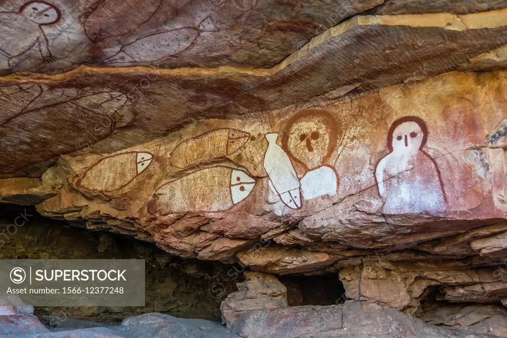 Aboriginal Wandjina cave artwork in sandstone caves at Raft Point, Kimberley, Western Australia, Australia.