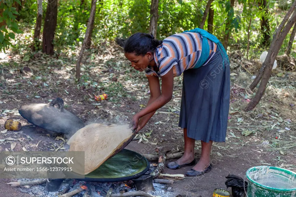 A Young Woman Making Injera (Ethiopian Flat Bread), Lalibela, Ethiopia.