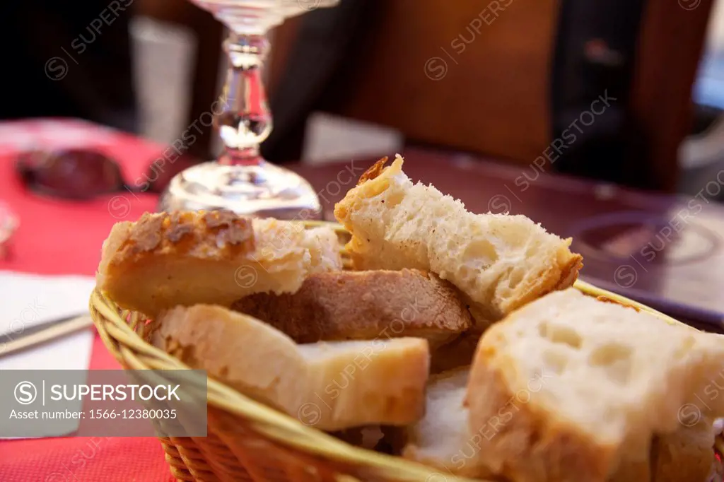 assortment of baked bread on wood table.
