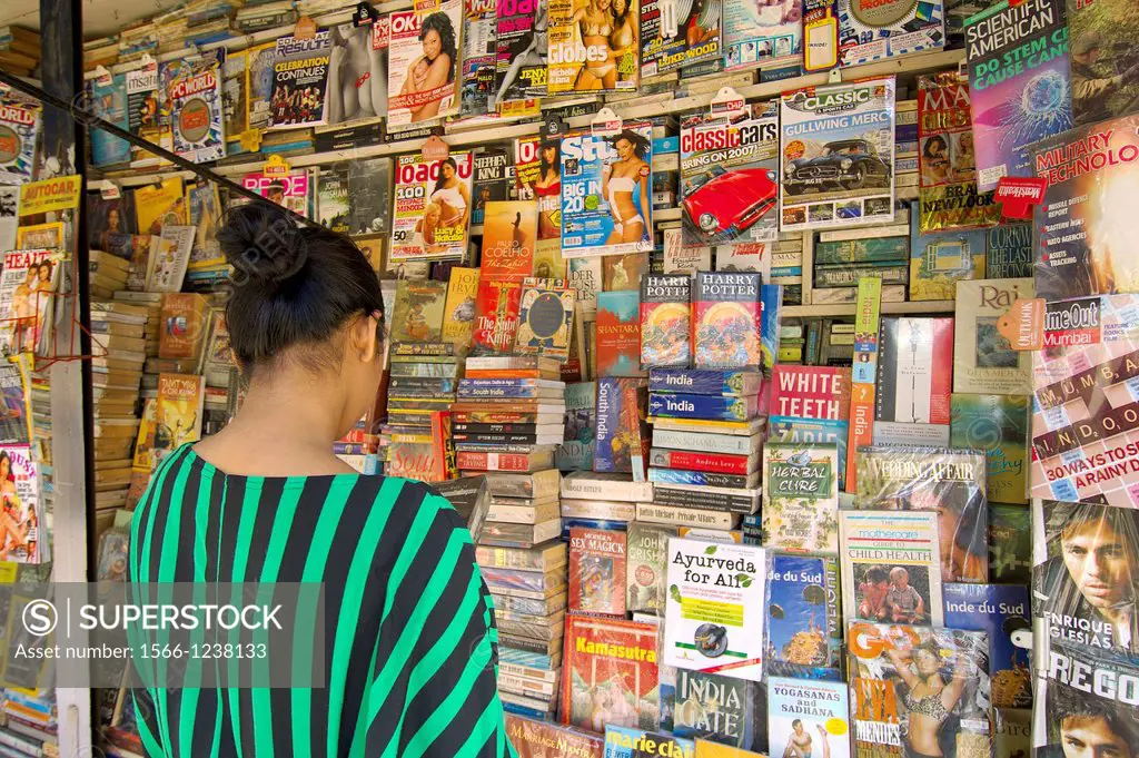 a woman shop in a newspaper stand  mumbai south  mumbay city  maharashtra  india  asia