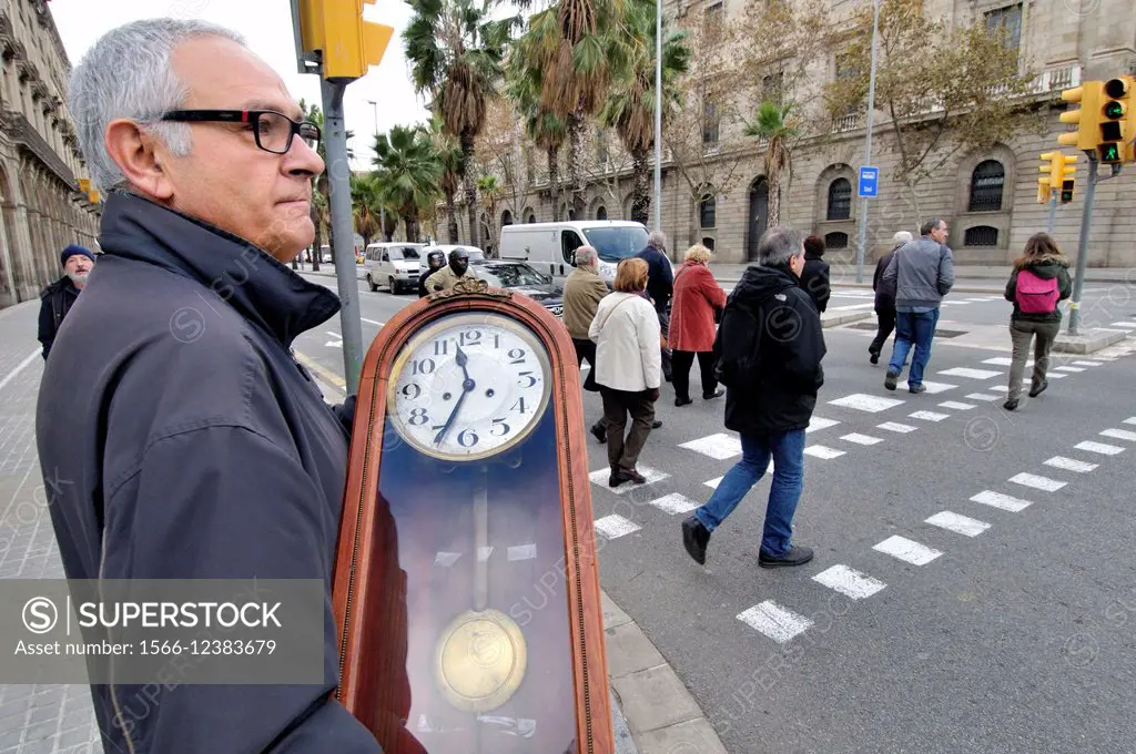Man with a clock, Barcelona, Catalonia, Spain