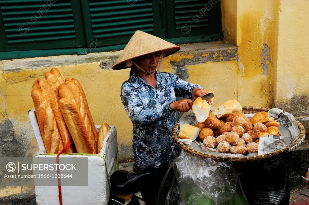 Vendor of bread in Hanoi,Vietnam,Asia