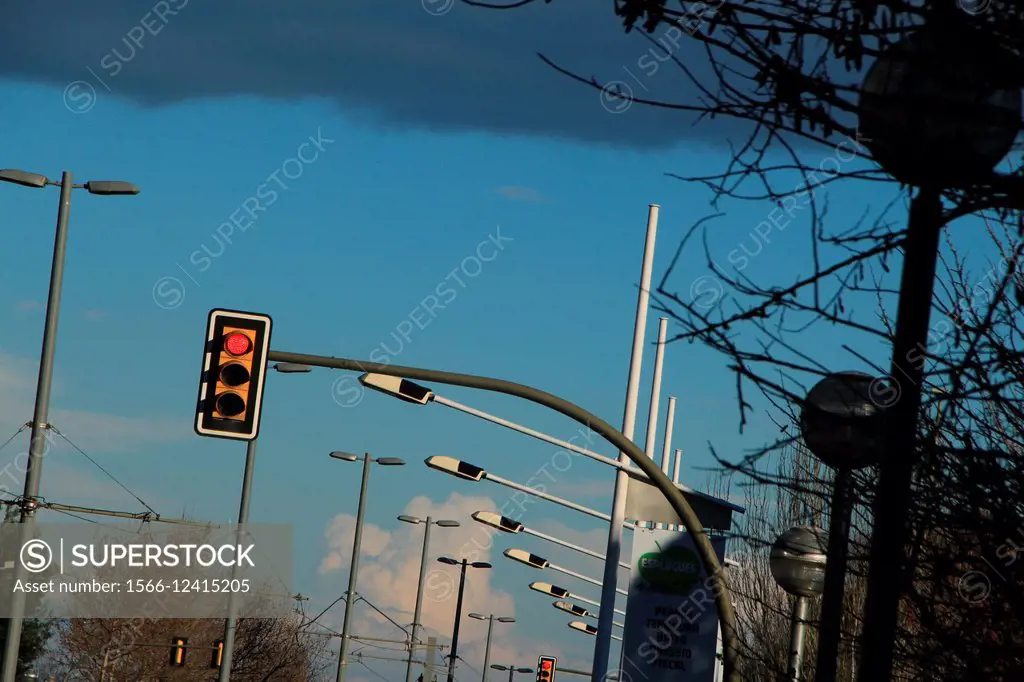 Traffic light on red and street lights. Esplugues de Llobregat, Barcelona province, Catalonia, Spain