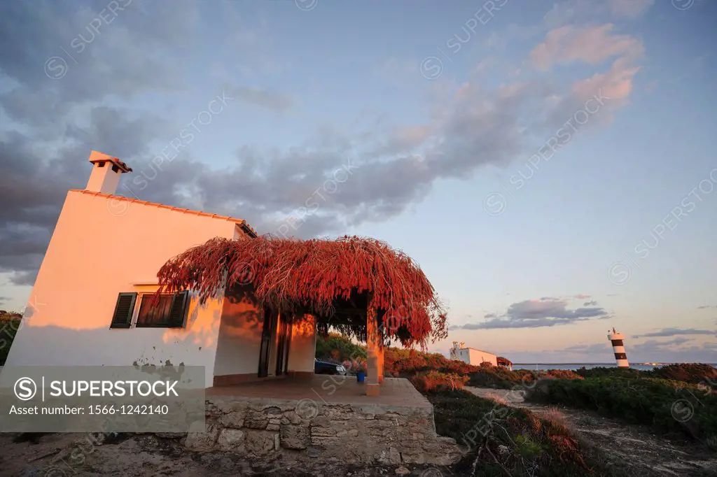 bottom fishing shacks and lighthouse, S´Estalella, Estanyol, llucmajor, mallorca, Balearic Islands, Spain, Europe
