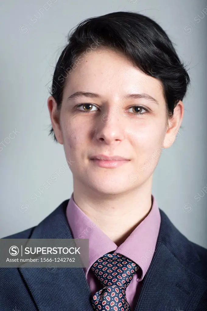 Tilburg, Netherlands  Portrait or headshot of a young woman, dressed up as a businessman