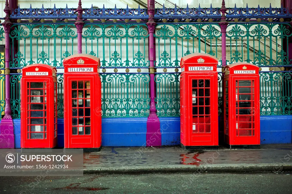 Red telephone box in Smithfield Market in Farringdon, London, England, UK, meat market