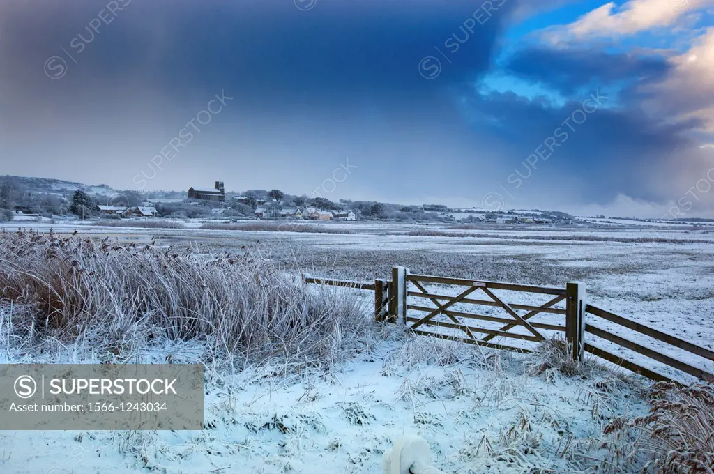 Salthouse village and grazing marshes Norfolk in Winter snow