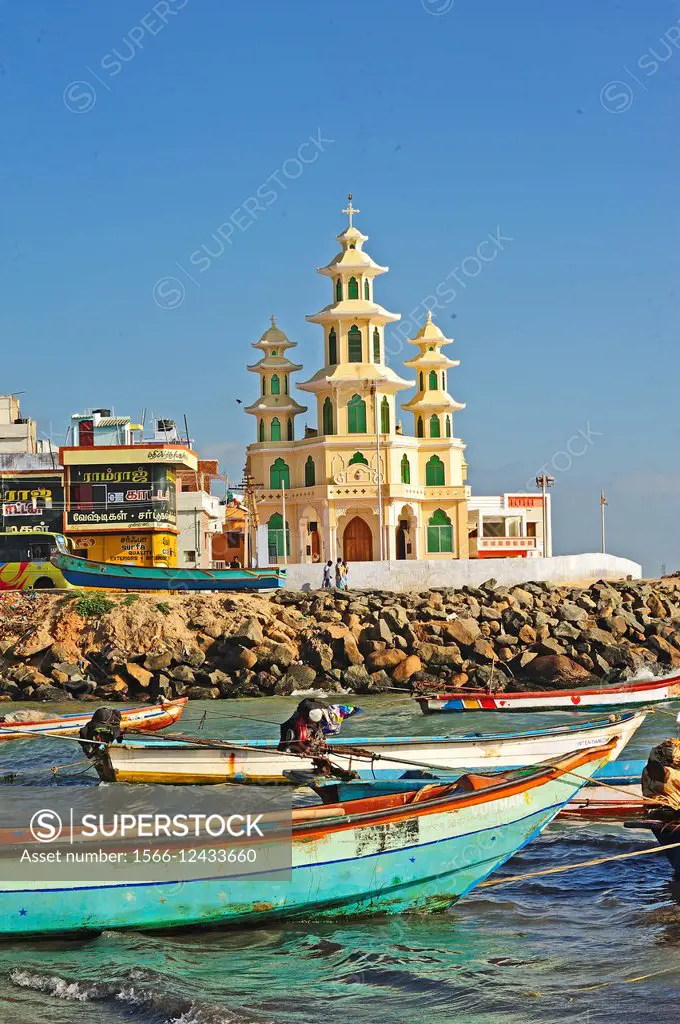 fishing boats and St. Arockia Nathar Church, Kanyakumari, Tamil Nadu, India.