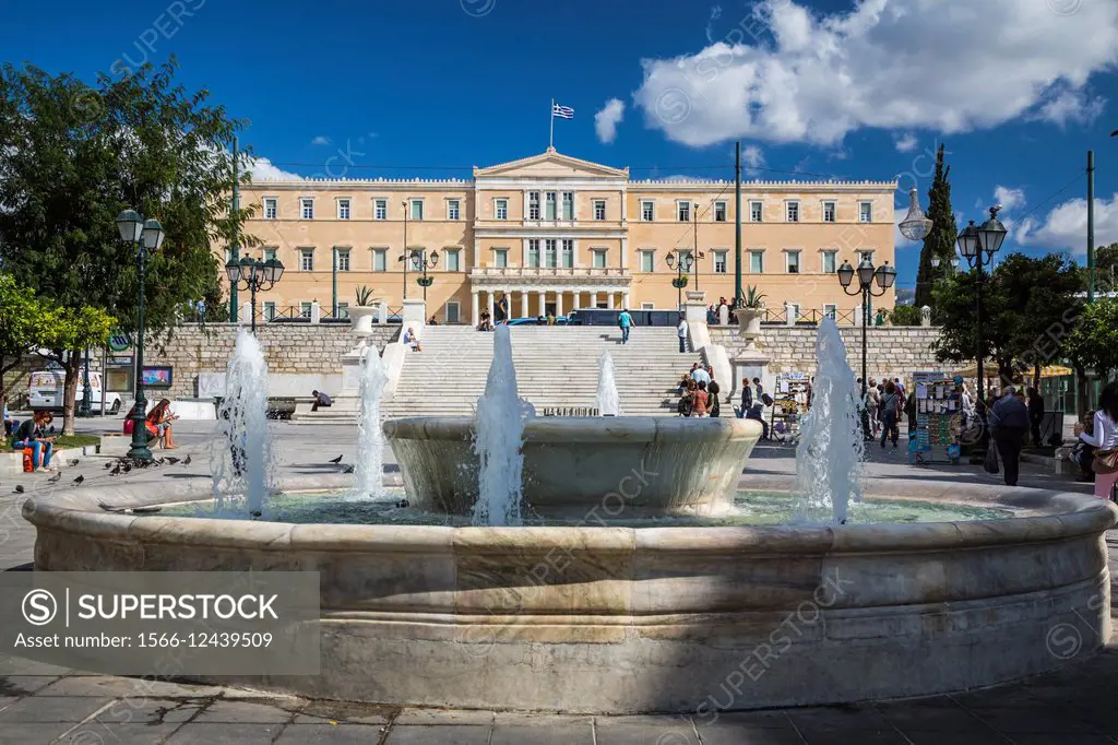 Decorative water fountains and the Parliament buildings at Syntagma Square, Athens, Greece, Europe.
