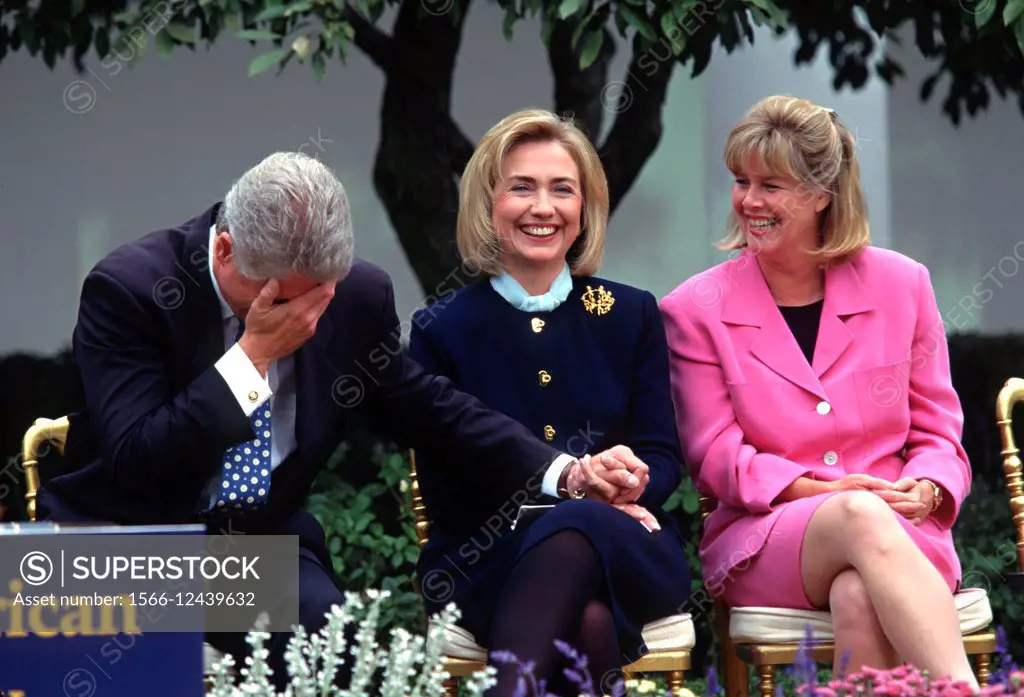 US President Bill Clinton jokes with first lady Hillary Clinton and Tipper Gore during an event at the White House March 22, 1997 in Washington, DC.