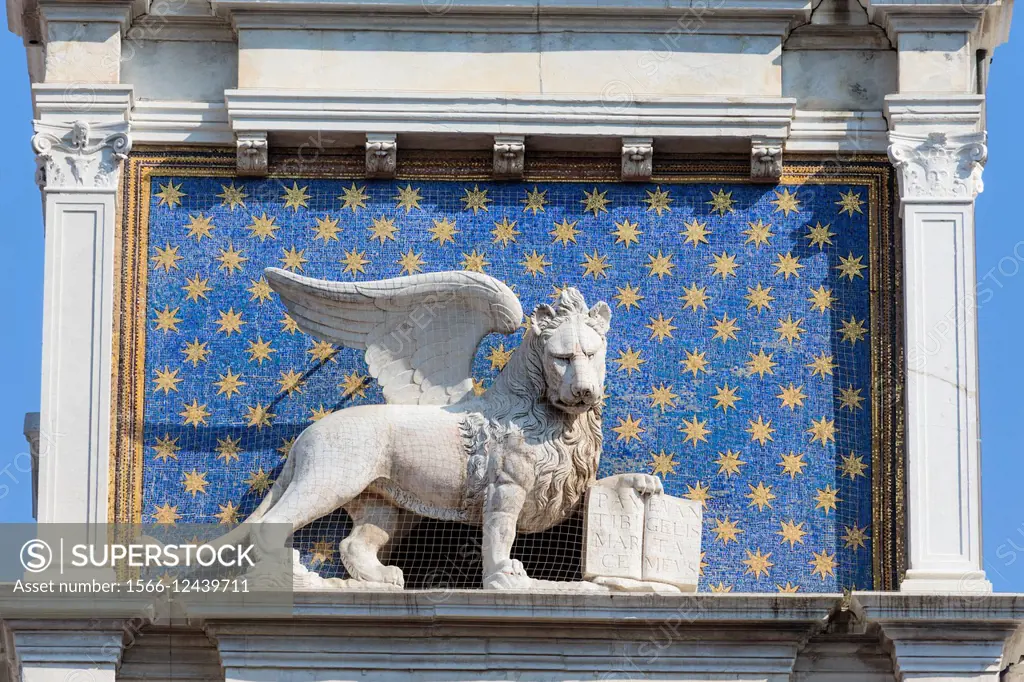 Venice, Venice Province, Veneto, Italy. The winged lion with the book is an iconic symbol of Venice. This one is on the Torre dell´Orologio, or the Cl...