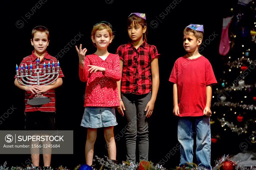 Deaf Jewish children act out a skit in sign language during a Christmas/Hanukah pageant at the California School for the Deaf in Riverside, CA. Note m...