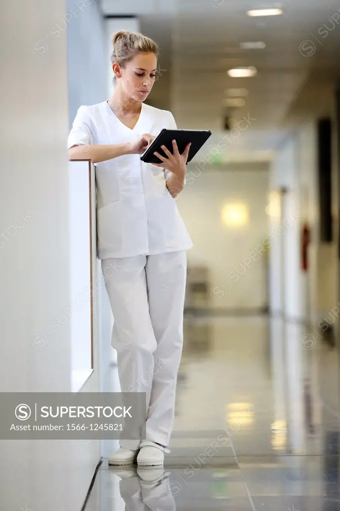 Nurse with tablet in corridor, Onkologikoa Hospital, Oncology Institute, Case Center for prevention, diagnosis and treatment of cancer, Donostia, San ...