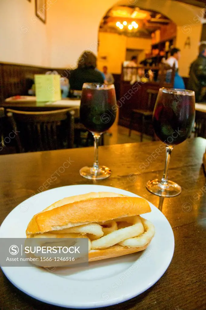 Fried squids sandwich with sangria in a typical bar. Madrid, Spain.