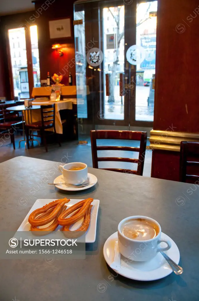 Coffee with churros for breakfast. Madrid, Spain.