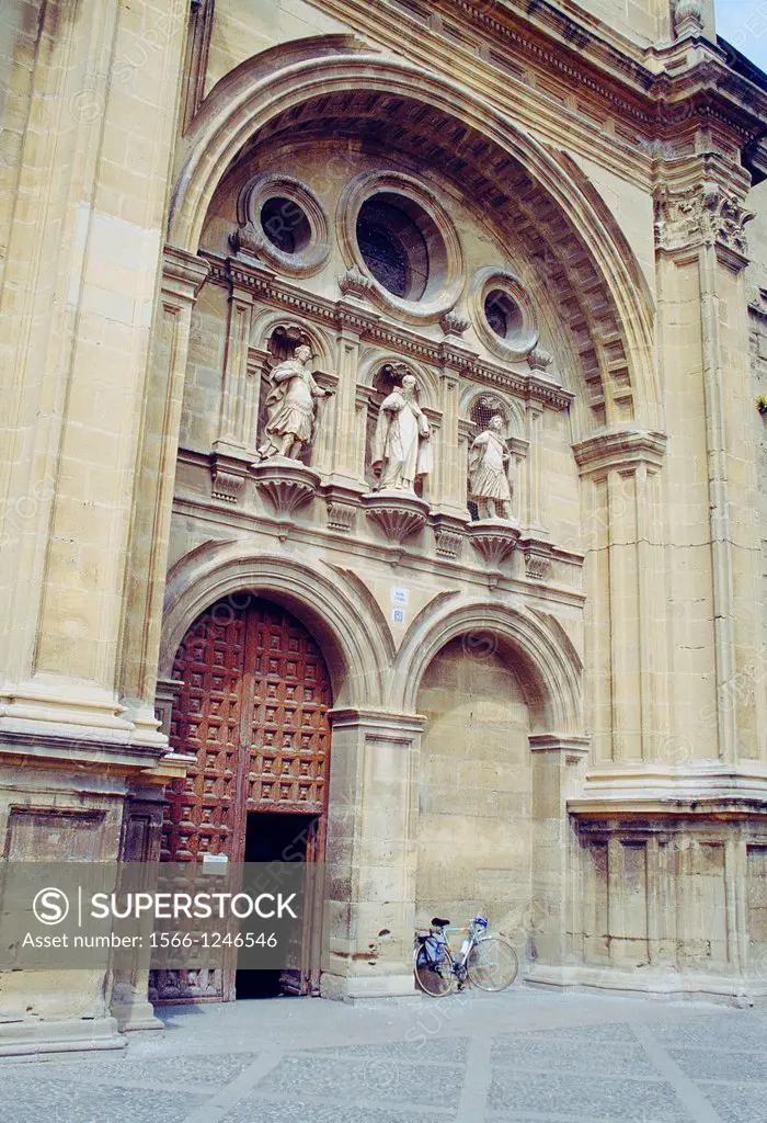 Facade of the cathedral and parked bike. Santo Domingo de la Calzada, La Rioja, Spain.