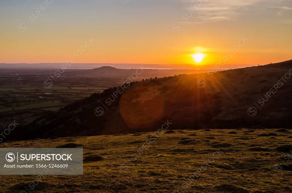 Winter sunset viewed from Cross Plain over Wavering Down on the Mendip Hills  Axbridge, Somerset, England