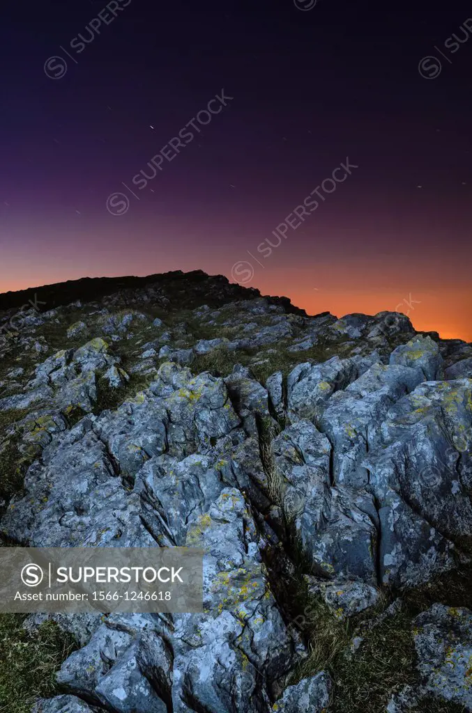Limestone outcrop at Crook Peak in the Mendip Hills at night near Axbridge, Somerset, England