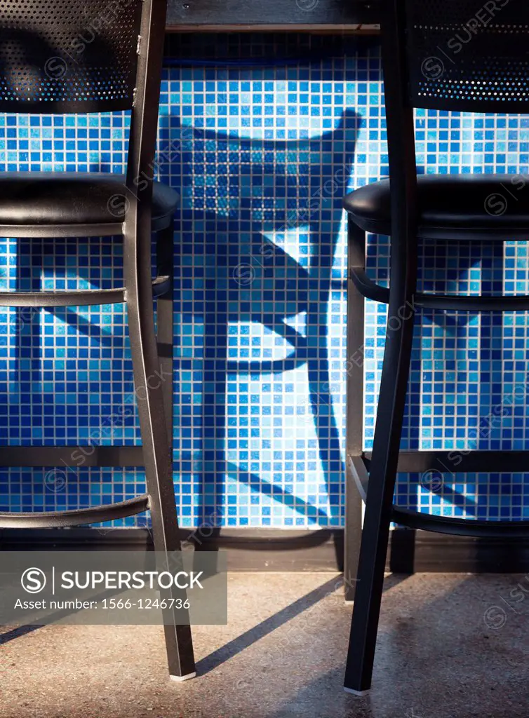 Bar stools and shadows at Jake´s Place, Vero Beach, Florida, USA.