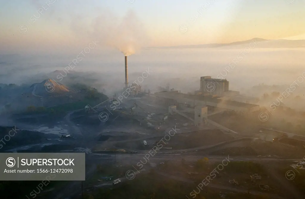 Aerial of factory with smoke, Frederick Maryland.