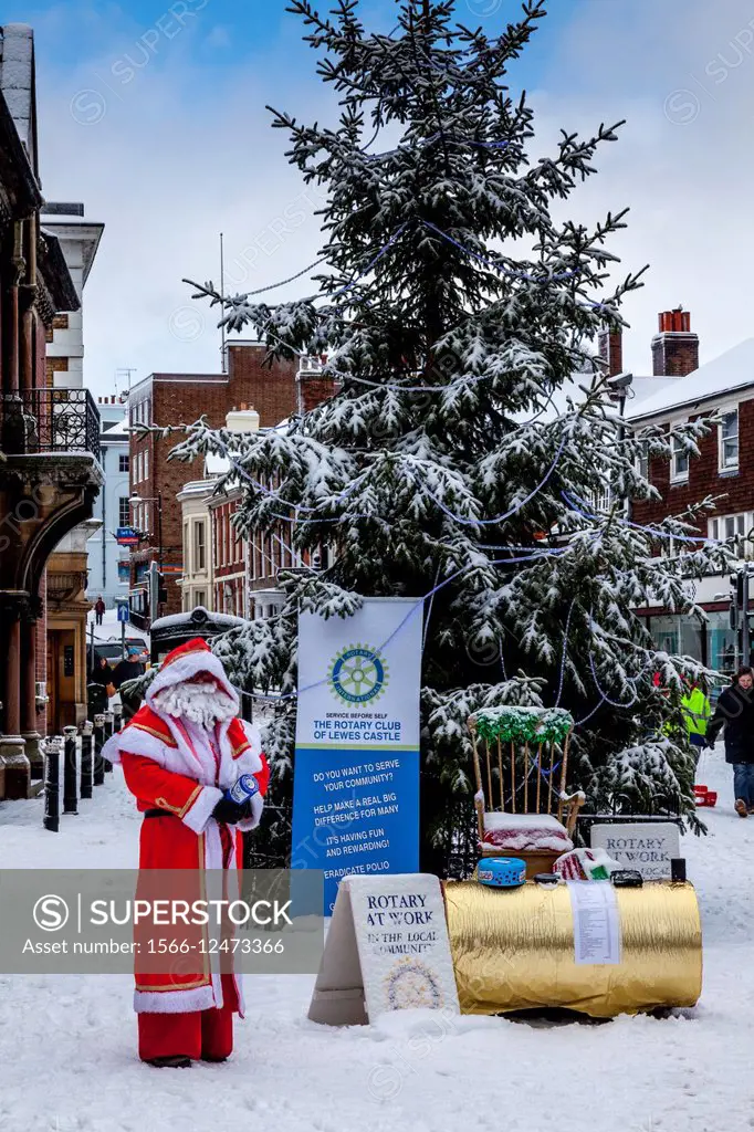 A Member of Lewes Rotary Club Collects Money For Charity Dressed As Father Christmas, Lewes, Sussex, UK.
