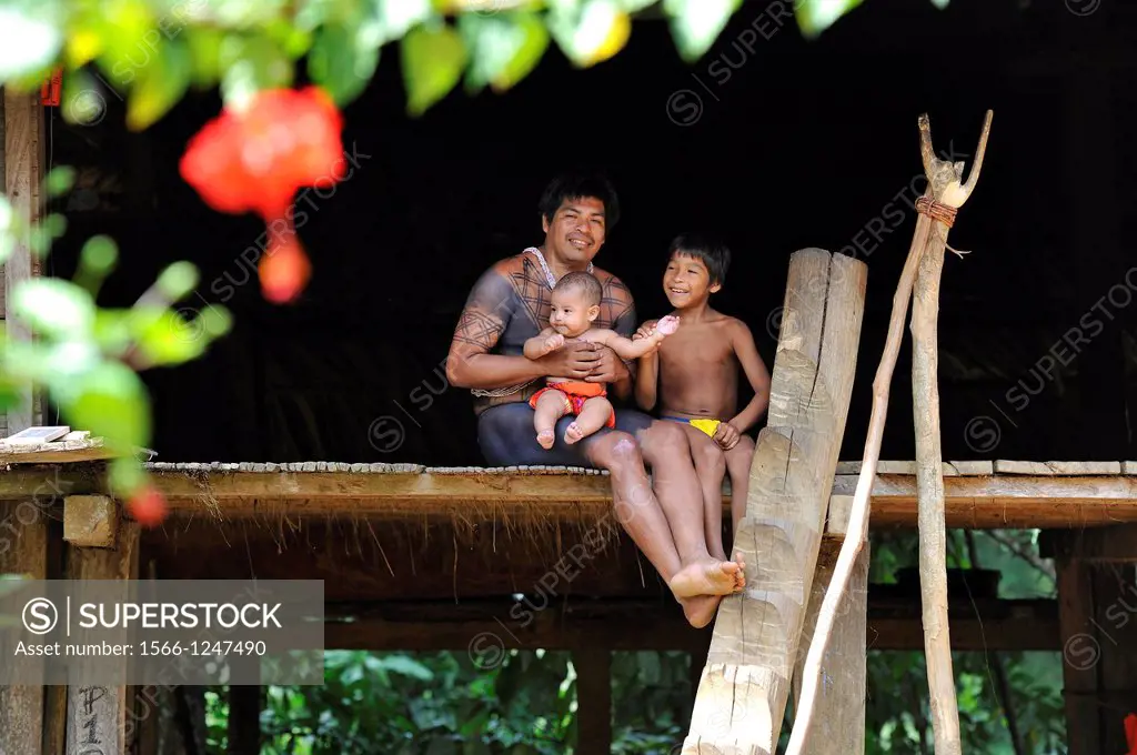 man and children of Embera native community living by the Chagres River within the Chagres National Park, Republic of Panama, Central America
