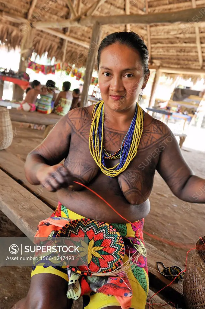 woman weaving basket, Embera native community living by the Chagres River within the Chagres National Park, Republic of Panama, Central America