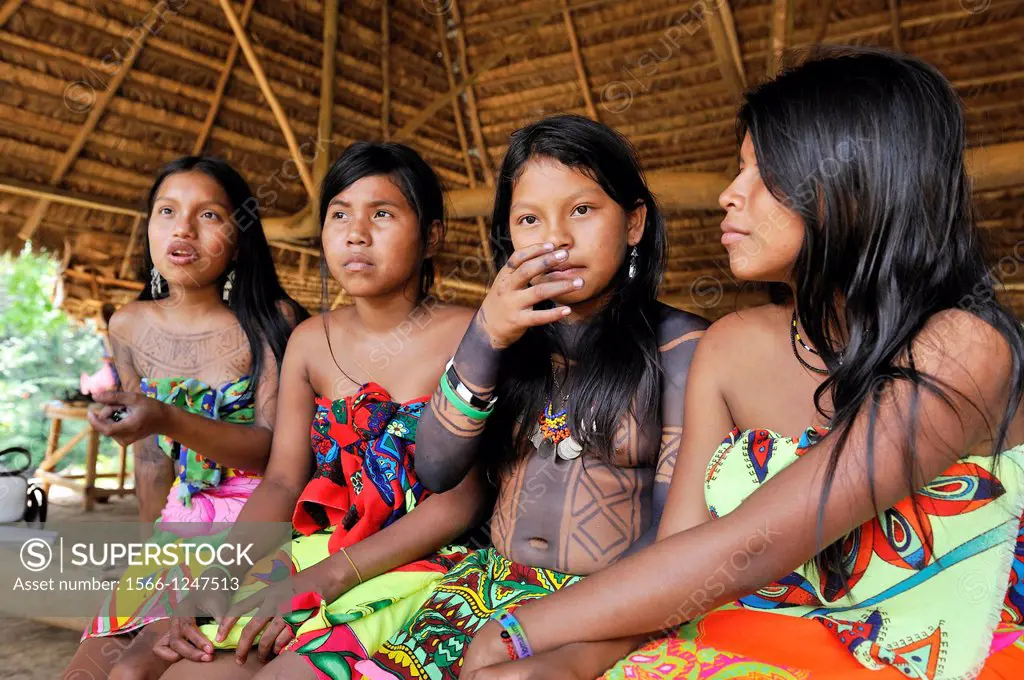 Esilda on left and her friends, young teenagers of Embera native community living by the Chagres River within the Chagres National Park, Republic of P...