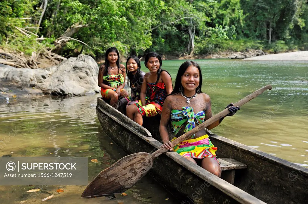 Esilda and her friends on pirogue, young teenagers of Embera native community living by the Chagres River within the Chagres National Park, Republic o...