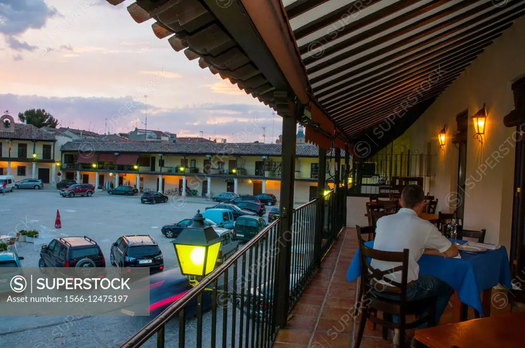 Terrace of restaurant in the Main Square, night view. Colmenar de Oreja, Madrid province, Spain.