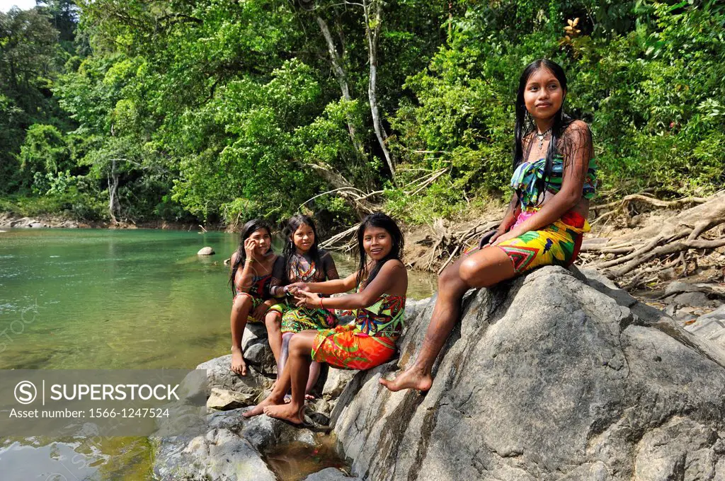 Esilda and her friends by the river, young teenagers of Embera native community living by the Chagres River within the Chagres National Park, Republic...