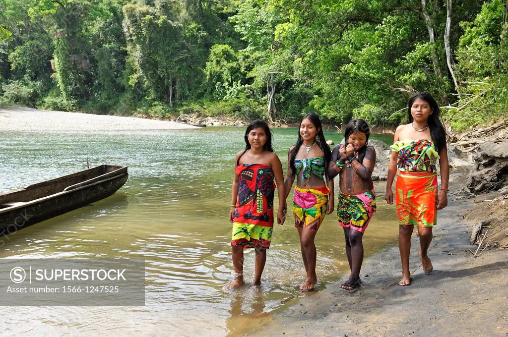 Esilda and her friends by the river, young teenagers of Embera native community living by the Chagres River within the Chagres National Park, Republic...