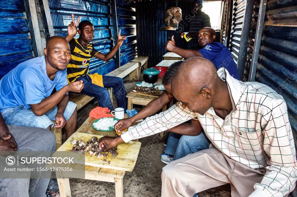 South Africa, African, Johannesburg, Soweto, Black, man, friends, eating, lunch.