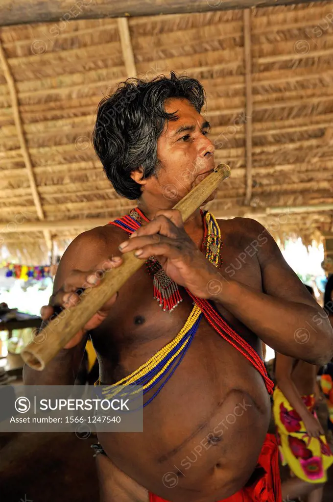 flute player, Embera native community living by the Chagres River within the Chagres National Park, Republic of Panama, Central America