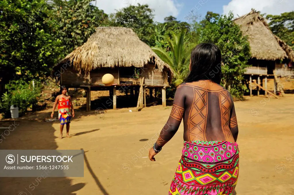 young girls playing football on a village´s square of Embera native community living by the Chagres River within the Chagres National Park, Republic o...