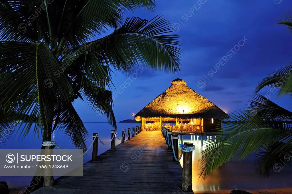 bar and restaurant on stilts at dusk, Playa Tortuga hotel, Colon Island, Bocas del Toro Archipelago, Republic of Panama, Central America