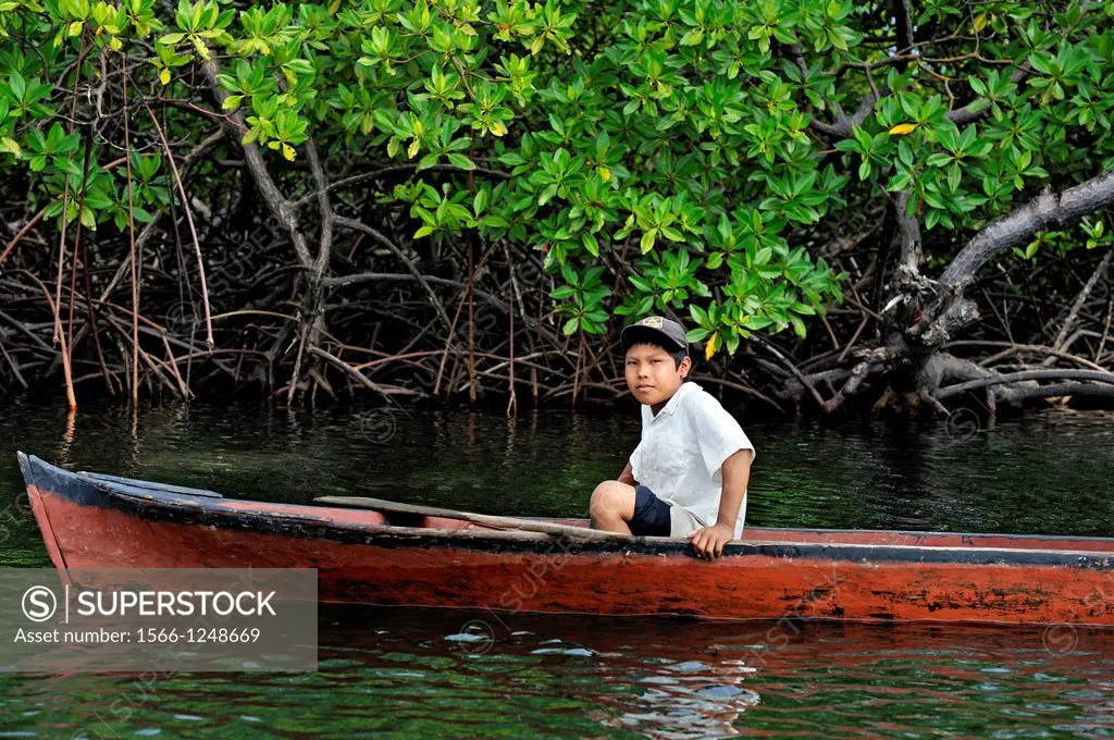young boy fishing in Isla Bastimentos National Marine Park, Bocas del Toro Archipelago, Republic of Panama, Central America
