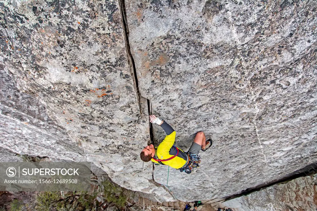 Rock climbing a route called Bloody Fingers which is rated 5,10 and located on Super Hits Wall at the City Of Rocks National Reserve near the town of ...