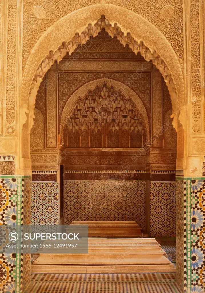 Ornate carved stone doorway with tiles, Bahia Palace, Marrakech, Morocco.