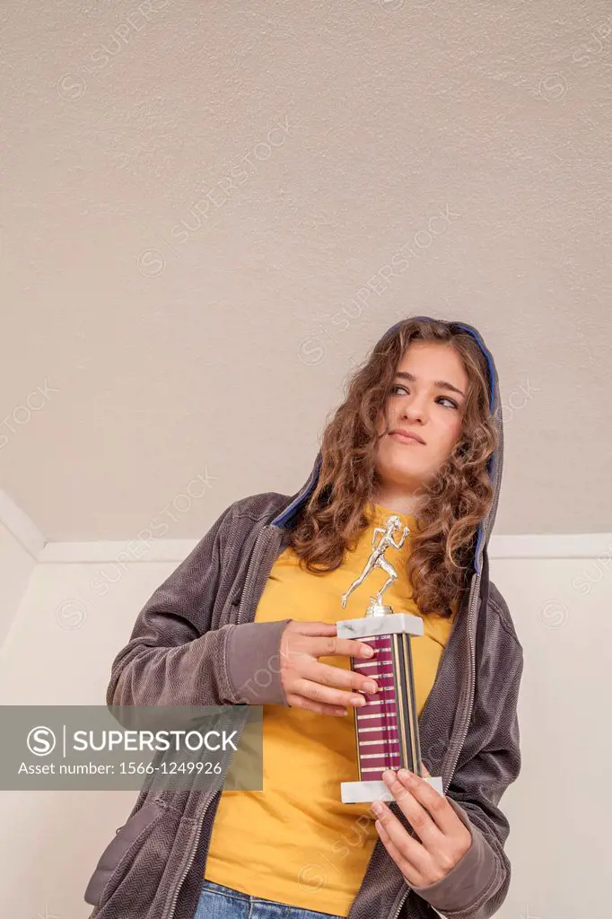 Teenage girl with a trophy