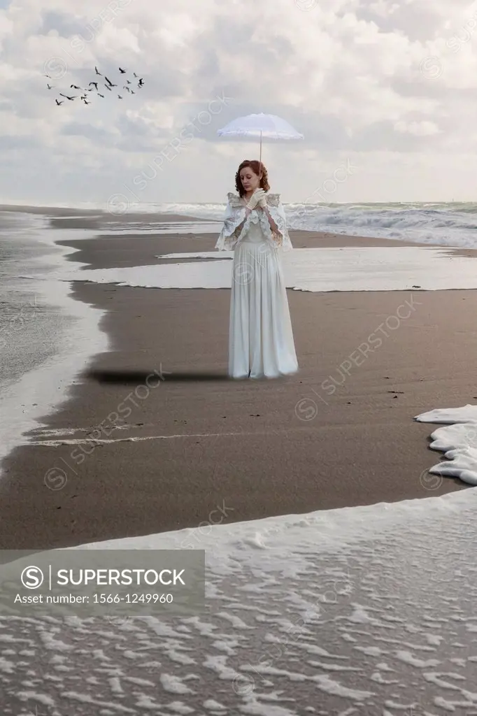 a woman in a victorian dress is walking along the shore of the sea