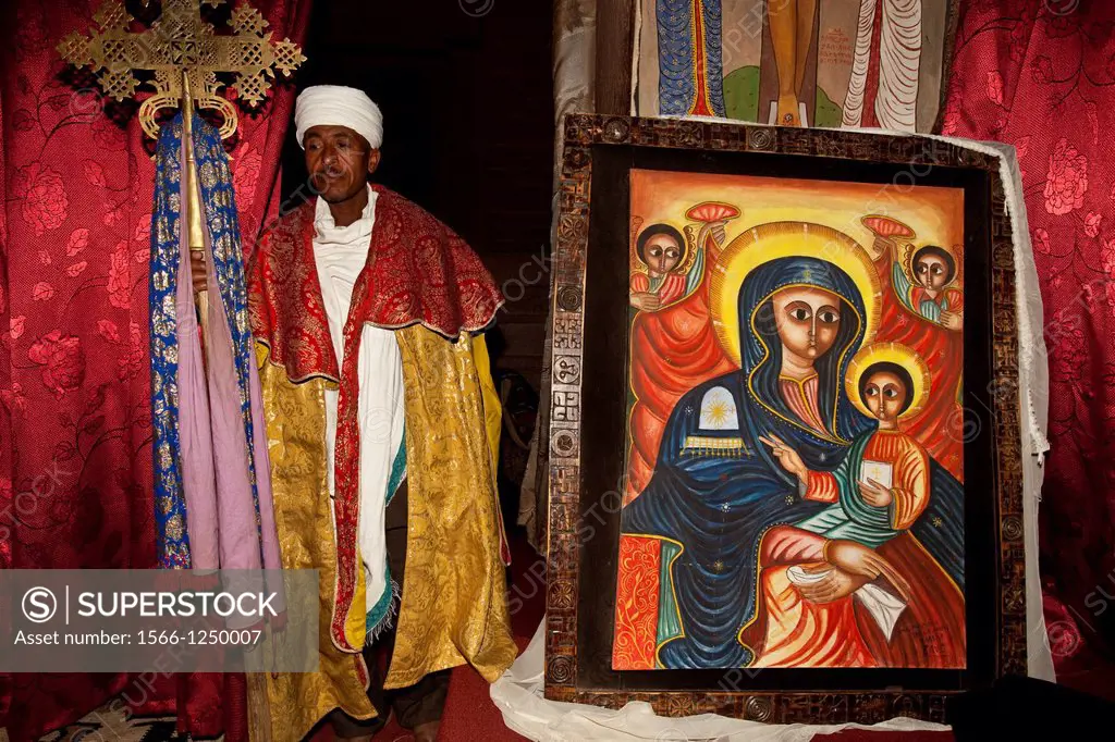 Priest and Colourful painting, Bet Emanuel Church, Lalibela, Ethiopia