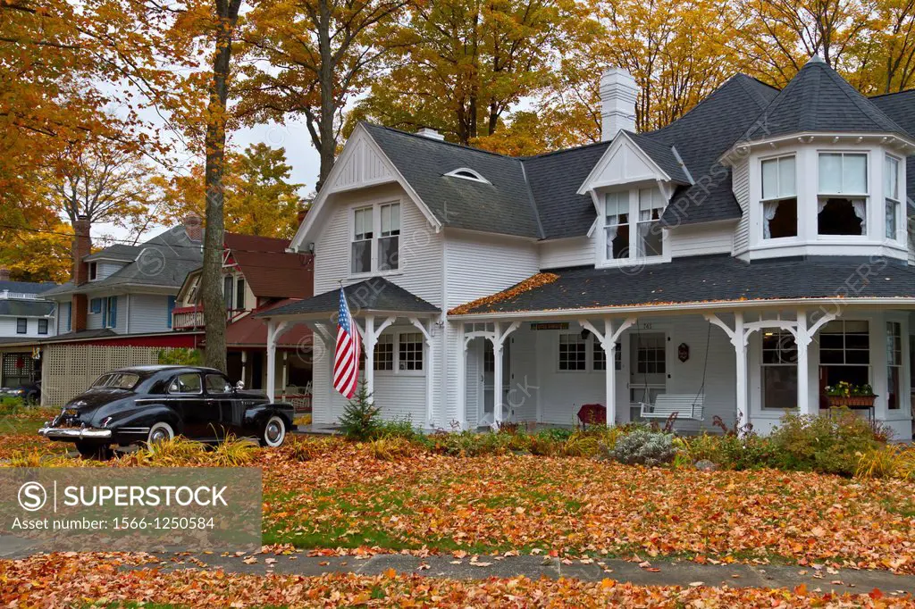 A Colonial home with fall foliage color in Petoskey, Michigan, USA