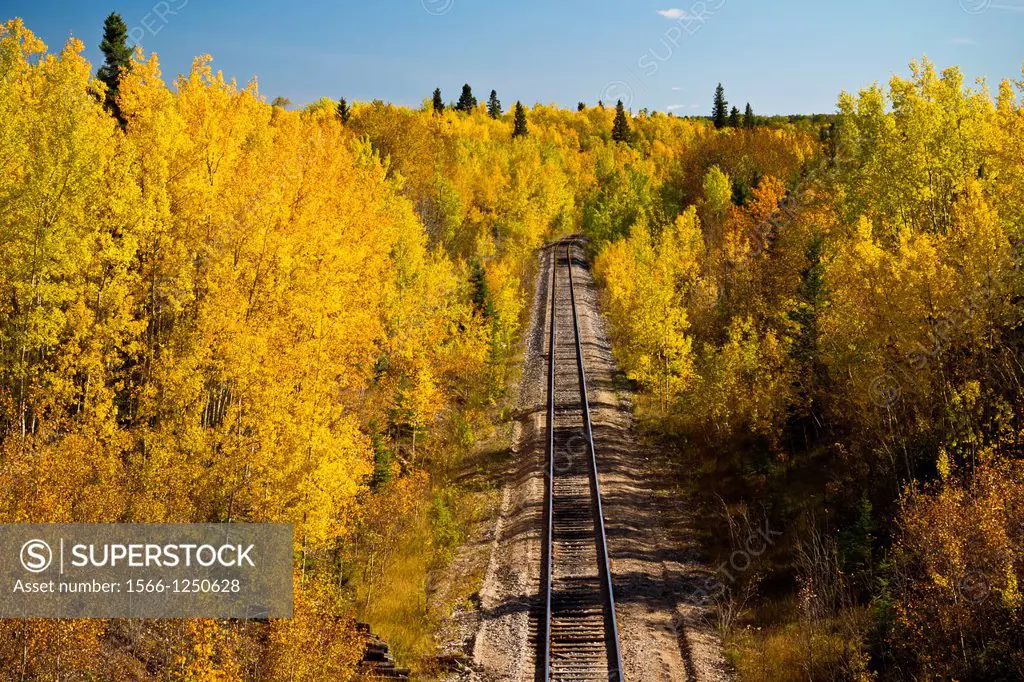 A train track in fall foliage color near Flin Flon, Manitoba, Canada