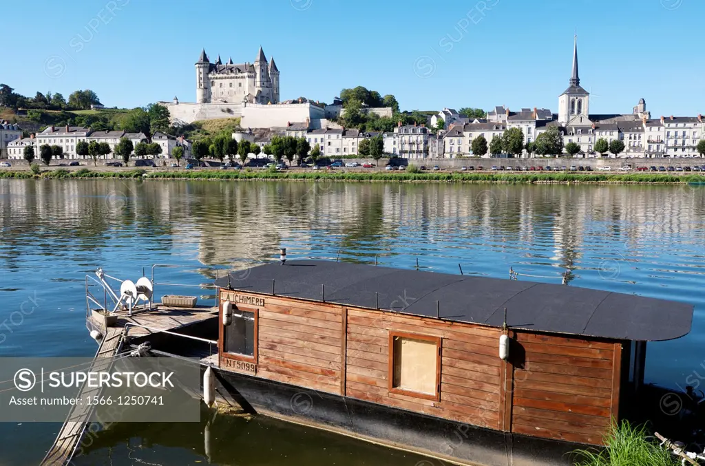 Boat on the River Loire in the town of Saumur, you can see the famous castle, Loire Valley, France