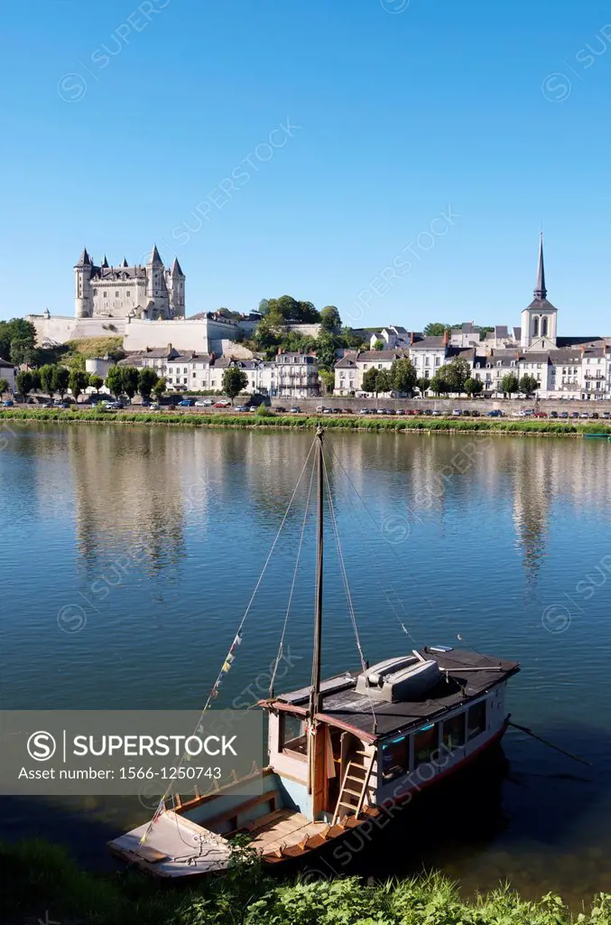 Boat on the River Loire in the town of Saumur, you can see the famous castle, Loire Valley, France